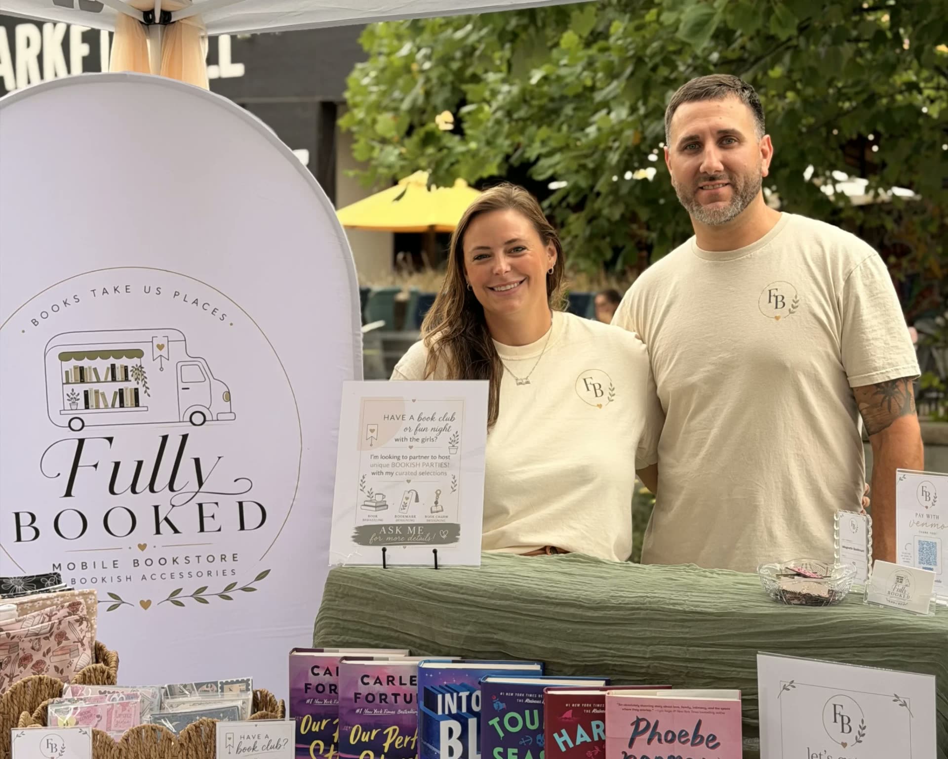 Fully Booked mobile bookstore booth at a Northeast Ohio market with books and bookish accessories